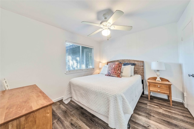 bedroom featuring ceiling fan and dark hardwood / wood-style flooring