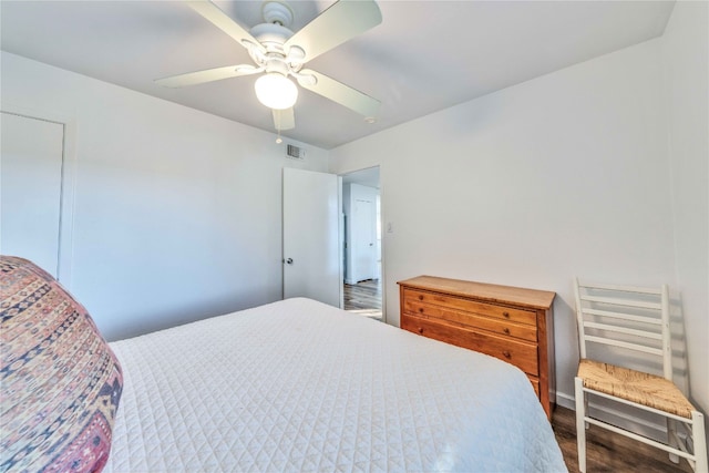 bedroom with wood-type flooring and ceiling fan