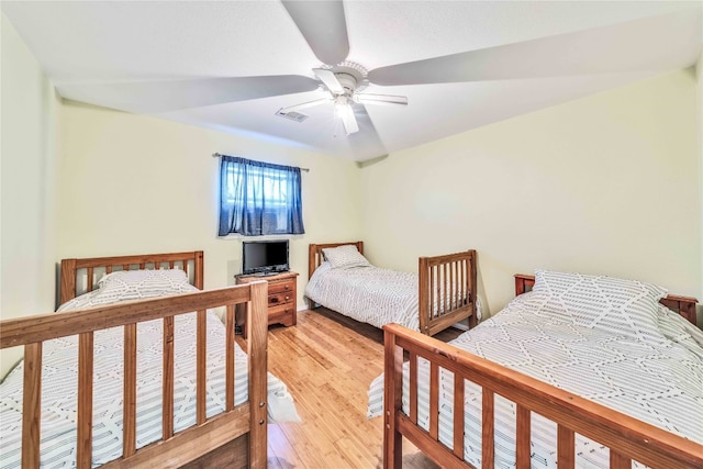 bedroom featuring ceiling fan and light hardwood / wood-style flooring