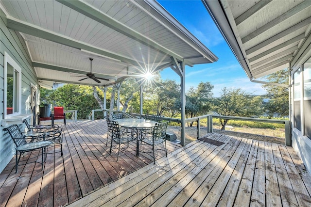 wooden deck featuring ceiling fan