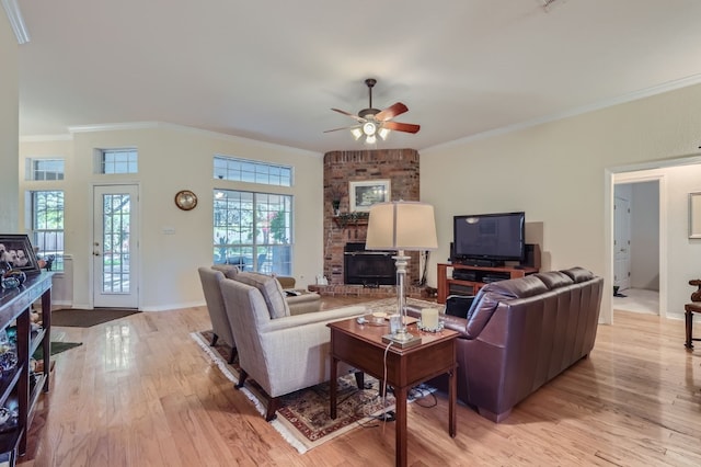 living room featuring light hardwood / wood-style floors, crown molding, and ceiling fan