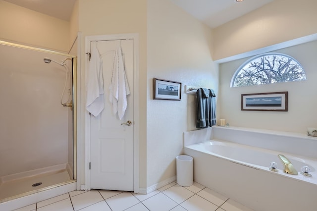 bathroom featuring independent shower and bath and tile patterned floors