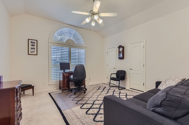 office space with ceiling fan, light colored carpet, and vaulted ceiling