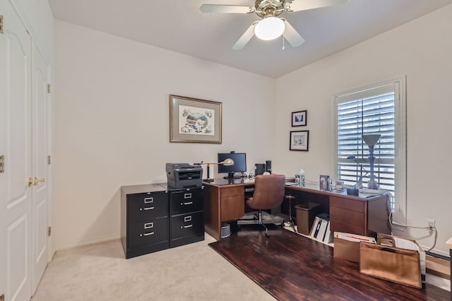 office area featuring light colored carpet and ceiling fan