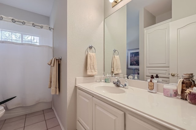 bathroom with vanity, curtained shower, toilet, and tile patterned floors