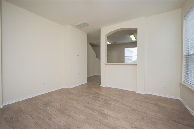 spare room featuring light hardwood / wood-style floors