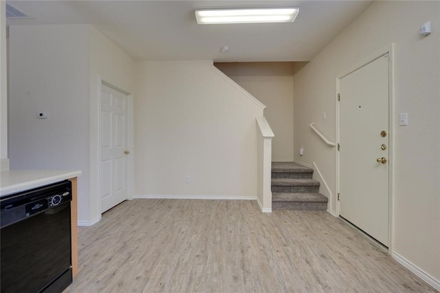 foyer with light wood-type flooring