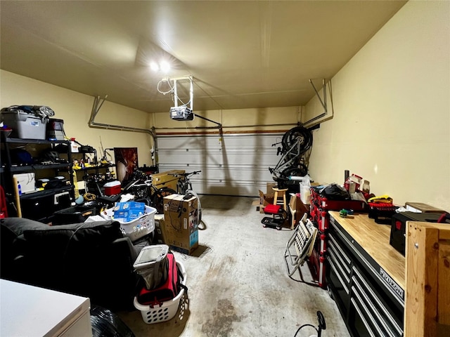 garage featuring a garage door opener and a workshop area