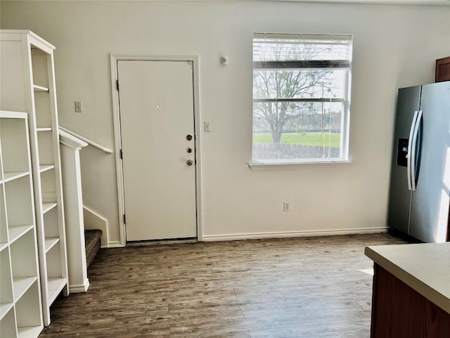 801 Jane Austen Trl Unit B, Pflugerville, TX 78660 - foyer entrance featuring healthy amount of natural light, wood finished floors, and stairs