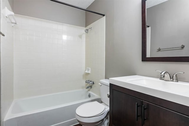 bathroom featuring shower / bath combination, vanity, and toilet