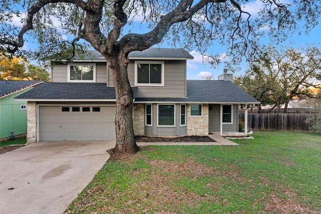 front facade featuring a garage and a front lawn