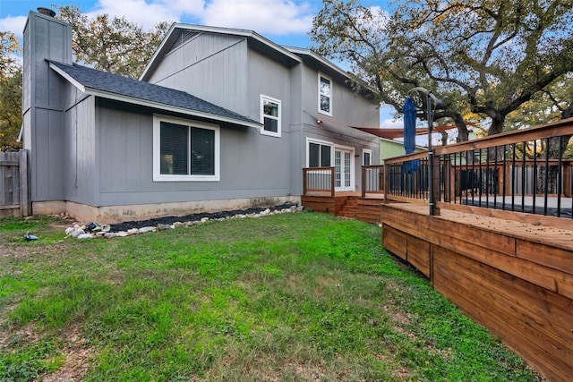 4308 Molokai Dr, Austin, TX 78749 - rear view of house with a deck, a chimney, a yard, a shingled roof, and french doors