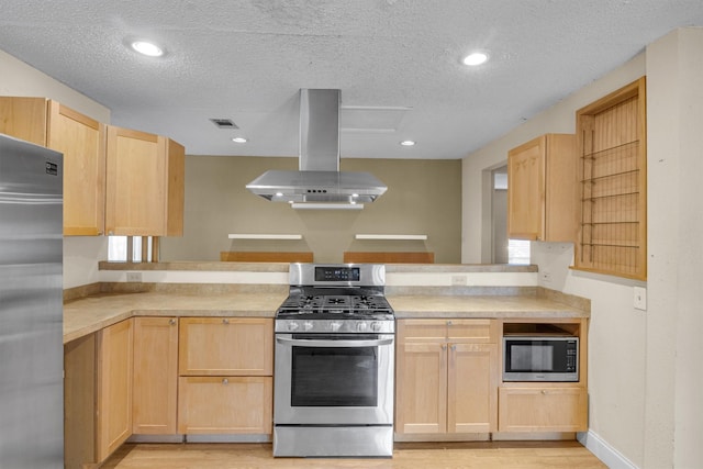 kitchen featuring built in appliances, a textured ceiling, island range hood, light wood-type flooring, and light brown cabinets