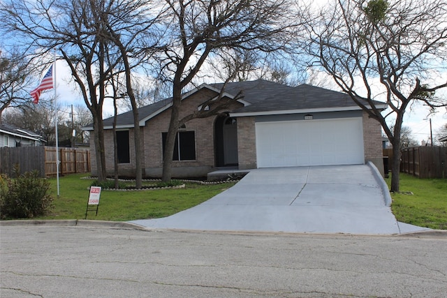 ranch-style house with a front yard and a garage