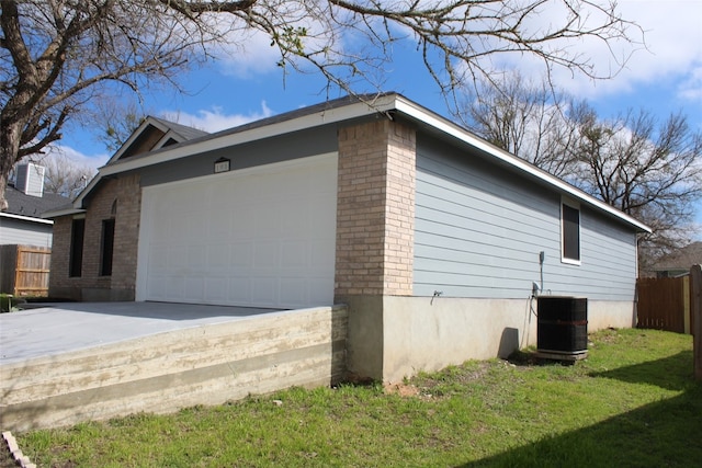 view of property exterior with a yard and a garage