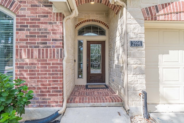 property entrance with a garage