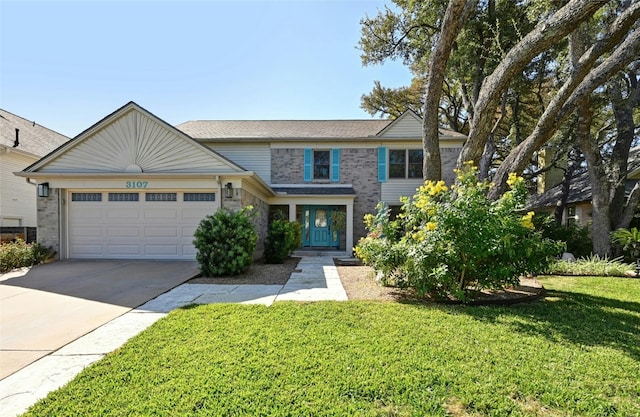 view of front facade with a front yard and a garage