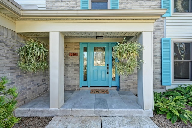 doorway to property featuring a porch