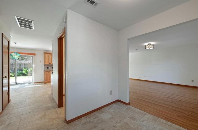 spare room featuring light hardwood / wood-style floors