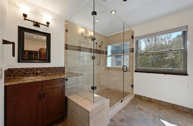 bathroom featuring vanity and an enclosed shower