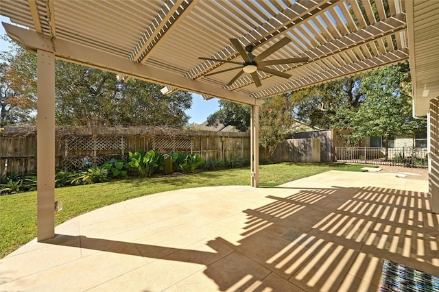 view of patio with ceiling fan and a pergola