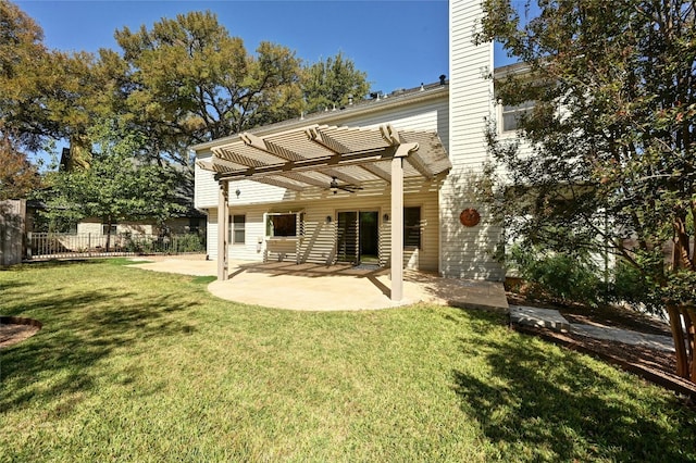 rear view of property featuring a patio area, a lawn, and a pergola