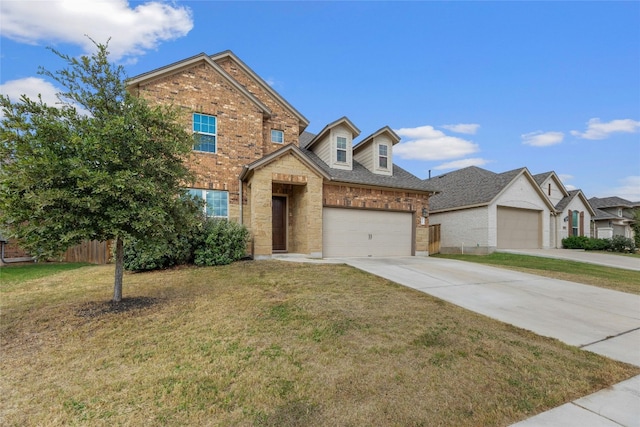 view of front of property featuring a garage and a front lawn