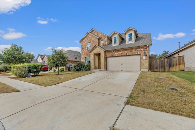 view of front property featuring a front yard and a garage