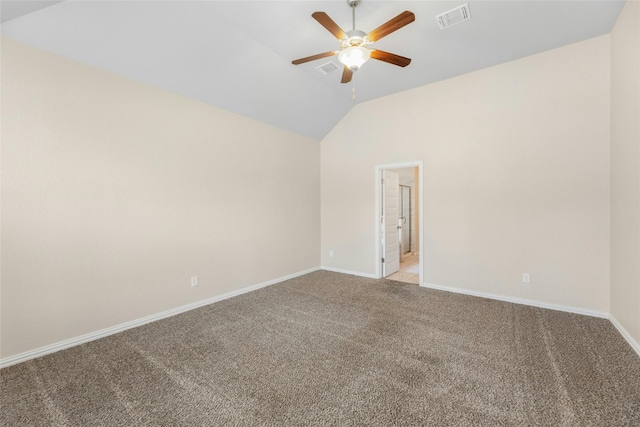 spare room featuring lofted ceiling, light carpet, and ceiling fan