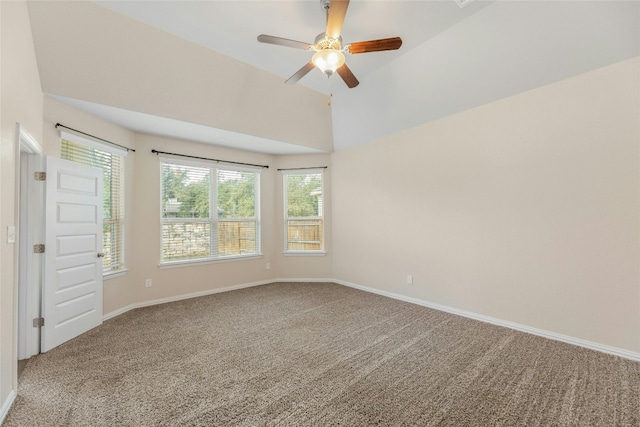 carpeted spare room with lofted ceiling and ceiling fan