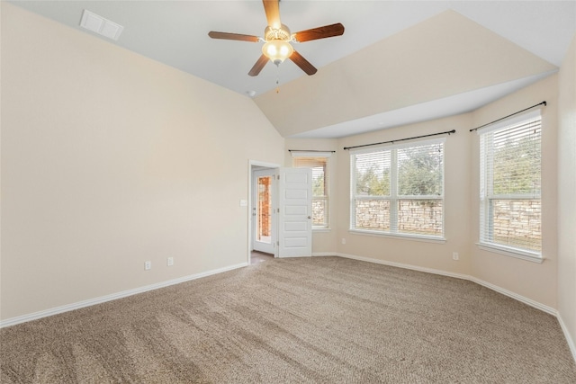 spare room featuring ceiling fan, lofted ceiling, and carpet floors