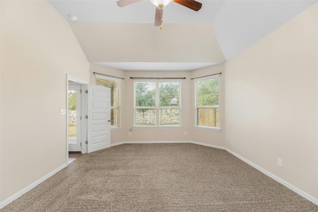 unfurnished room featuring ceiling fan, vaulted ceiling, and carpet floors