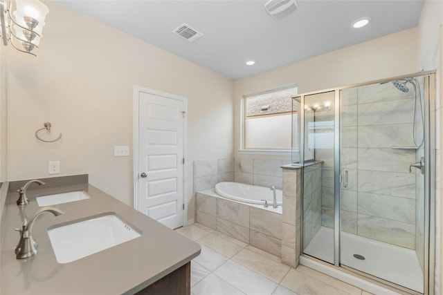 bathroom featuring vanity, tile patterned floors, and independent shower and bath