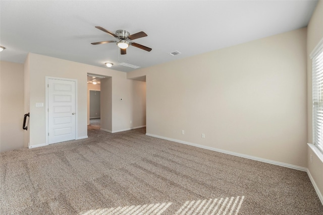 empty room featuring ceiling fan and carpet flooring