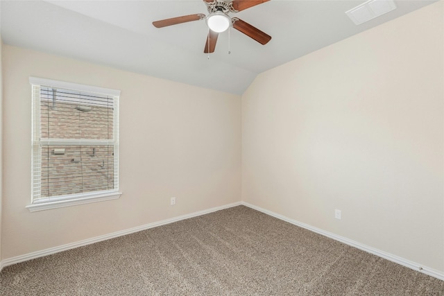 unfurnished room featuring ceiling fan, carpet flooring, and vaulted ceiling