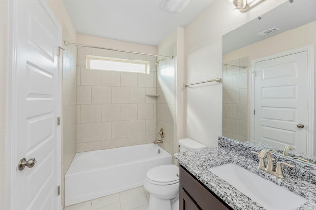 full bathroom with toilet, tiled shower / bath, vanity, and tile patterned flooring