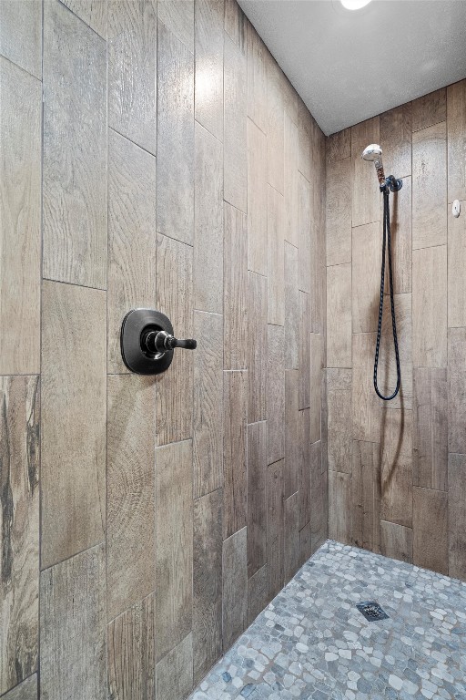 bathroom with tiled shower