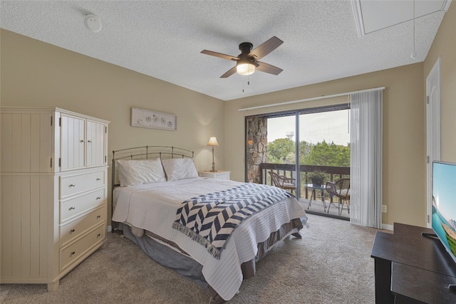 carpeted bedroom with a textured ceiling, access to outside, and ceiling fan