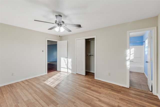 unfurnished bedroom featuring light hardwood / wood-style floors, a closet, and ceiling fan