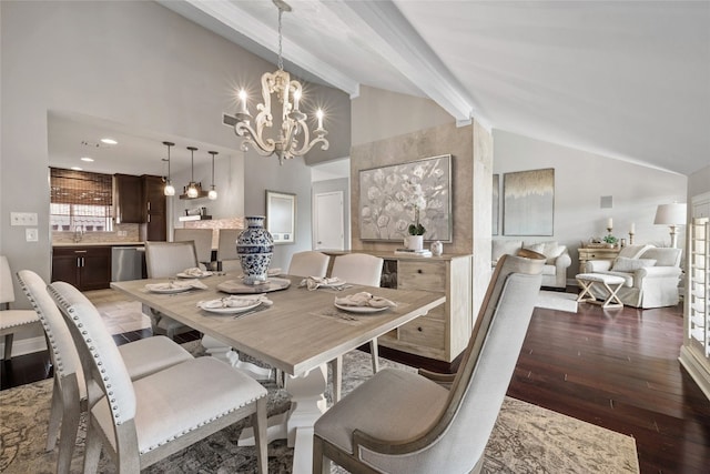 dining space featuring sink, beam ceiling, high vaulted ceiling, an inviting chandelier, and dark hardwood / wood-style floors