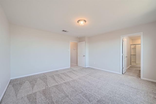 spare room with light colored carpet