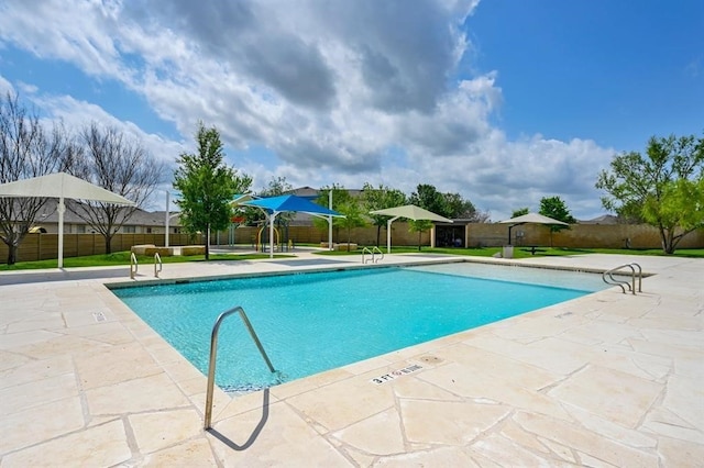 view of swimming pool with a patio area