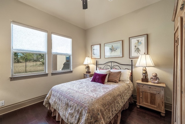 bedroom with dark wood-type flooring and ceiling fan