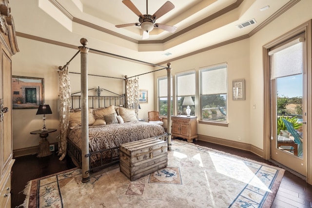 bedroom with access to outside, ceiling fan, wood-type flooring, and multiple windows