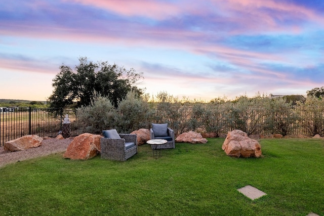 view of yard at dusk