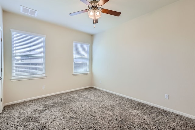 spare room with carpet floors and ceiling fan