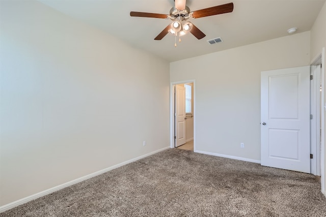 empty room with carpet and ceiling fan