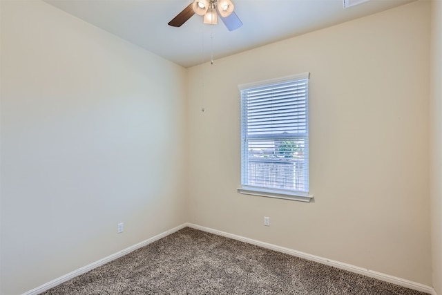 empty room featuring ceiling fan and carpet flooring