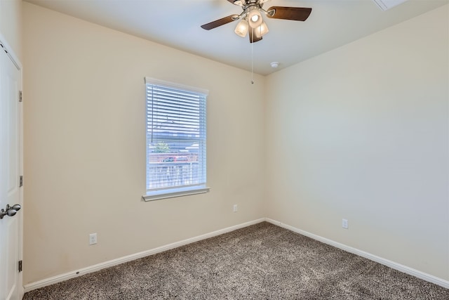 carpeted spare room with ceiling fan