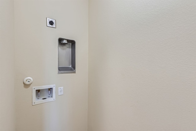 clothes washing area with electric dryer hookup, washer hookup, and hookup for a gas dryer